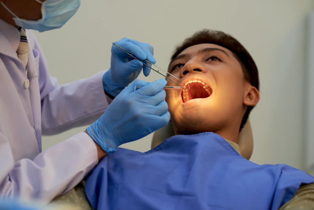 Tooth removal procedure by professional dentist in dental clinic