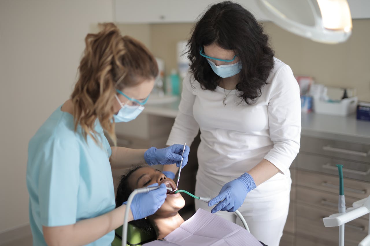Dentists treating patient’s teeth in modern clinic in Sydney for wisdom teeth removal