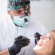 Dental treatment at a clinic Patient receiving professional dental treatment from a dentist inside a modern dental clinic